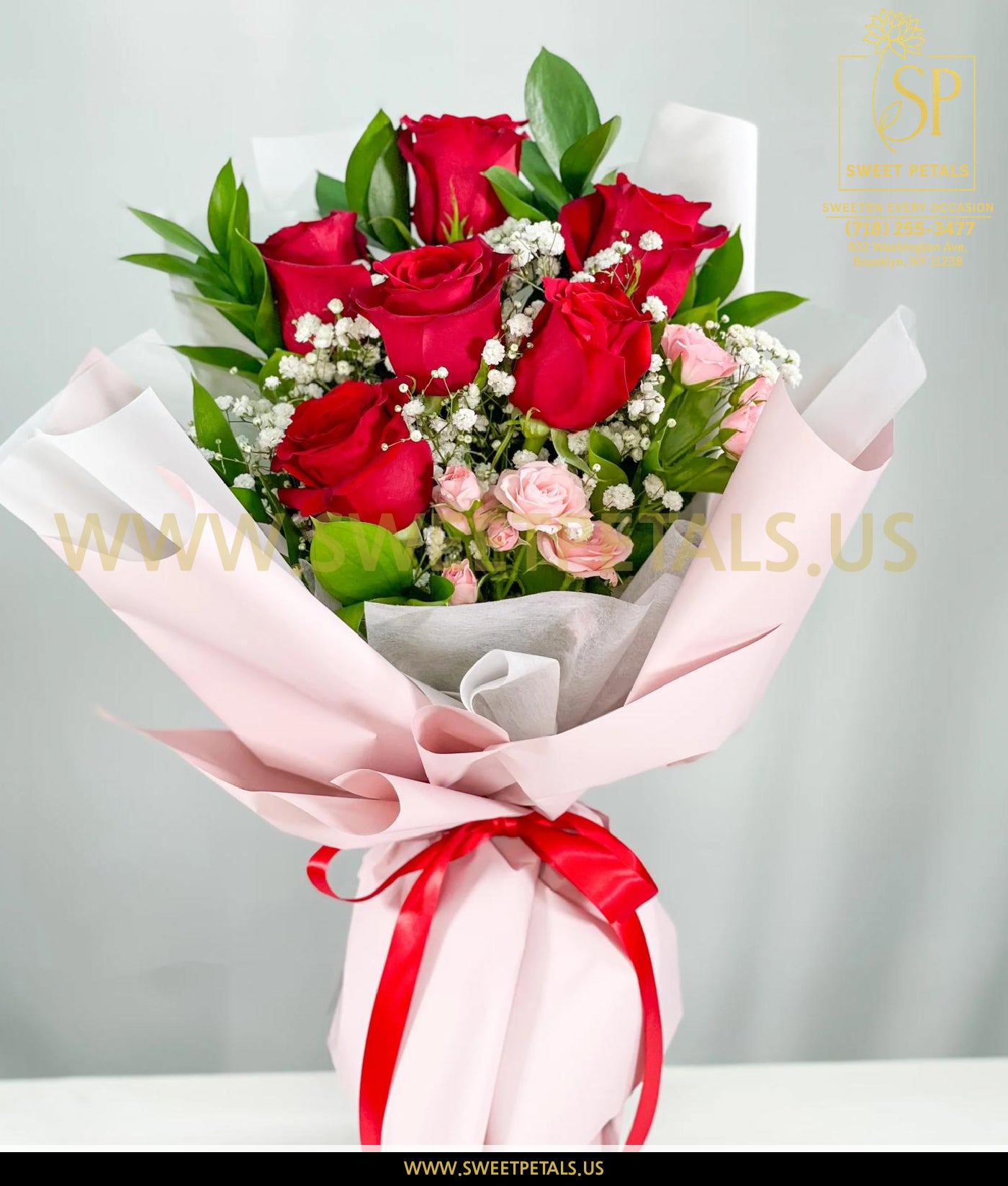 Romantic red and blush rose bouquet wrapped in soft pink paper with greenery and baby’s breath, perfect flower bouquet for Valentine Day and romantic gifting.