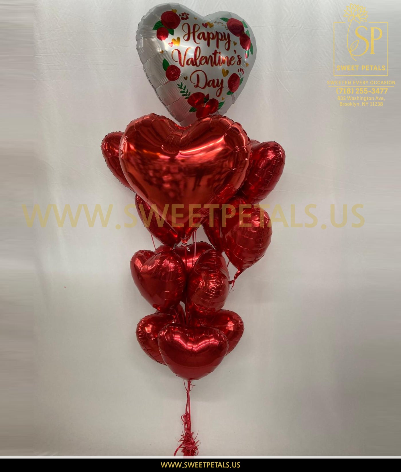 Crimson Hearts Valentine Balloon Bouquet with custom heart balloons made from red valentine’s day foil balloons, perfect romantic valentine balloons display