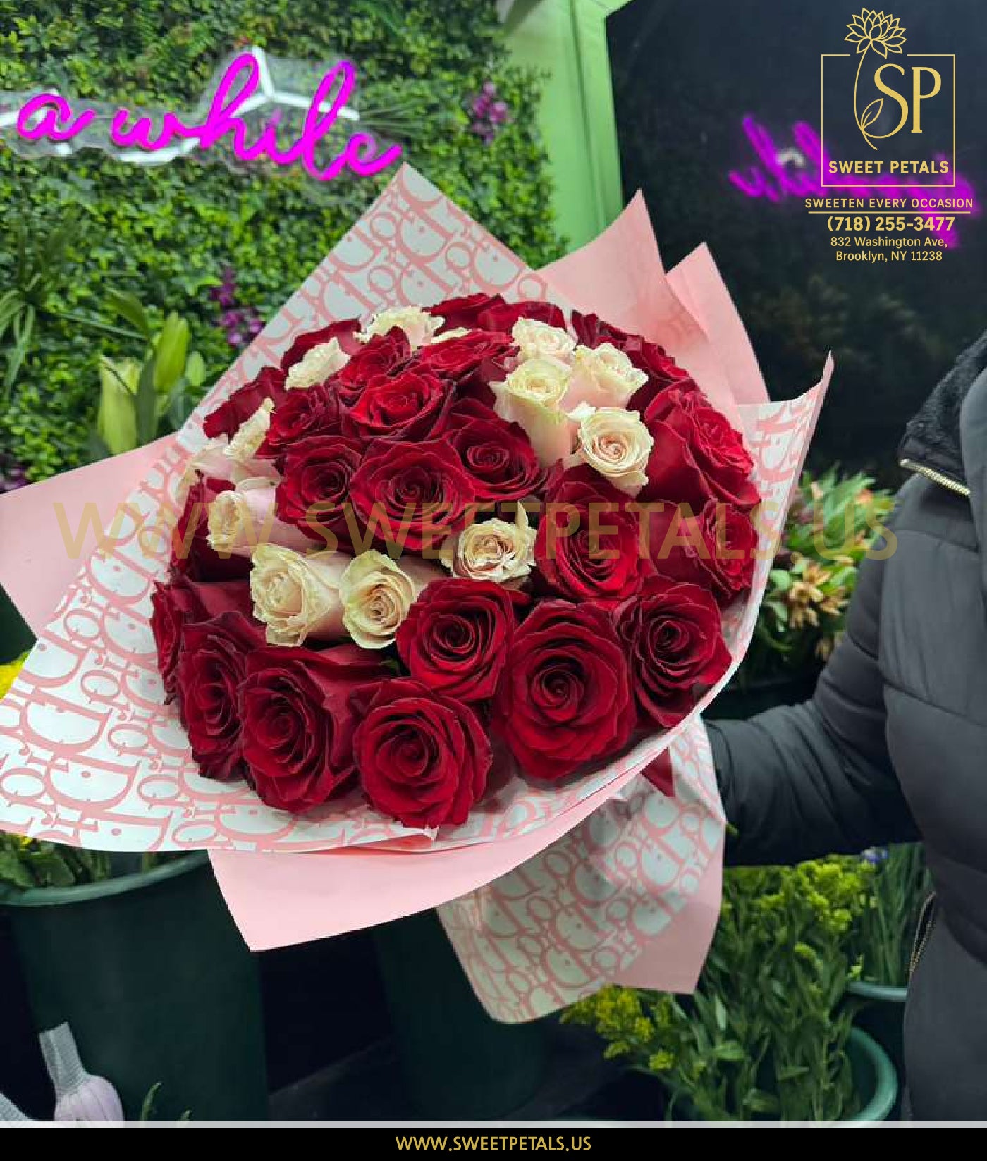 Elegant bouquet of red and white roses wrapped in soft pink paper, perfect to send Valentine’s flowers with fast Valentine’s roses delivery.