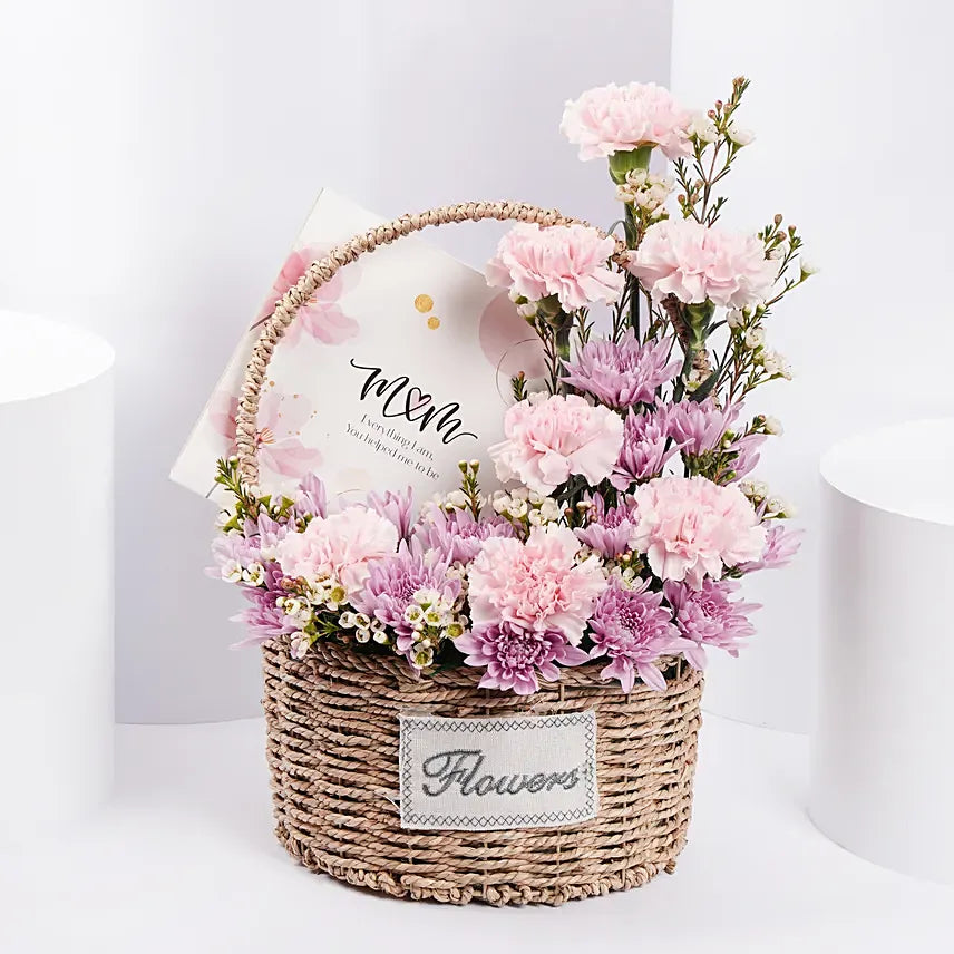 Because of You Love Exists – Pink Carnations & Purple Chrysanthemums in Woven Basket with Card