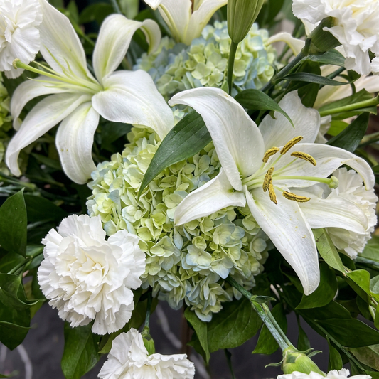 Close-up of white lilies, carnations and pale green hydrangea, SweetPetals USA