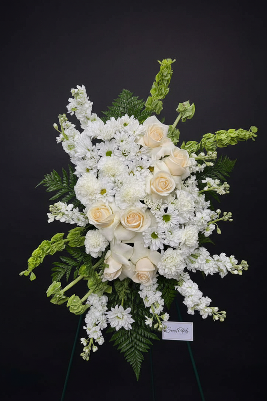 Close-up of cream roses and white chrysanthemums in grand all-white standing spray – SweetPetals luxury sympathy flowers