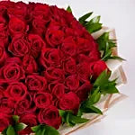 100 Red Rose Bouquet – Grand Luxury Red Roses with Green Leaves in Cream Paper Wrap