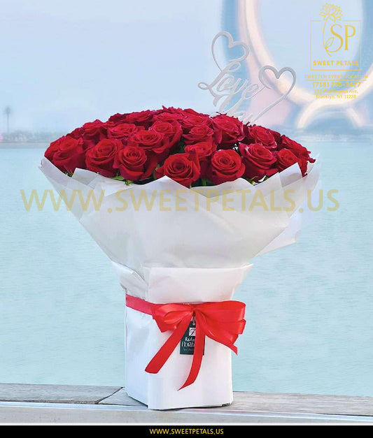Red rose bouquet for Valentine’s Day arranged in a white hatbox with a red ribbon, perfect flower bouquet for Valentine’s and get flowers delivered on Valentine’s Day gift.