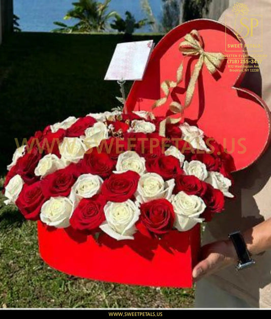 Heart-shaped flower heart box filled with red and white roses, a unique valentine's day flowers arrangement perfect as valentines gifts flowers.