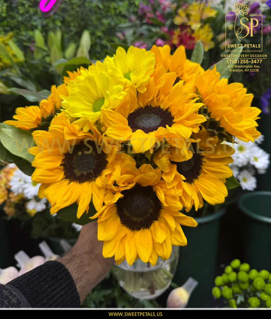 Golden Glow Bouquet by SweetPetals featuring fresh Helianthus sunflower flowers arranged beautifully in a clear crystal vase.