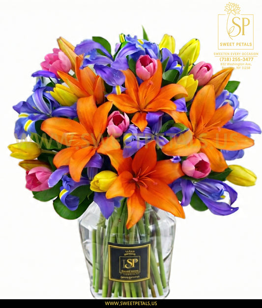 Kaleidoscope Blooms Bouquet featuring blooming tropical orange flower delivery with vivid orange orchid highlights, arranged in a lush, exotic floral display of fresh orange-toned blooms.