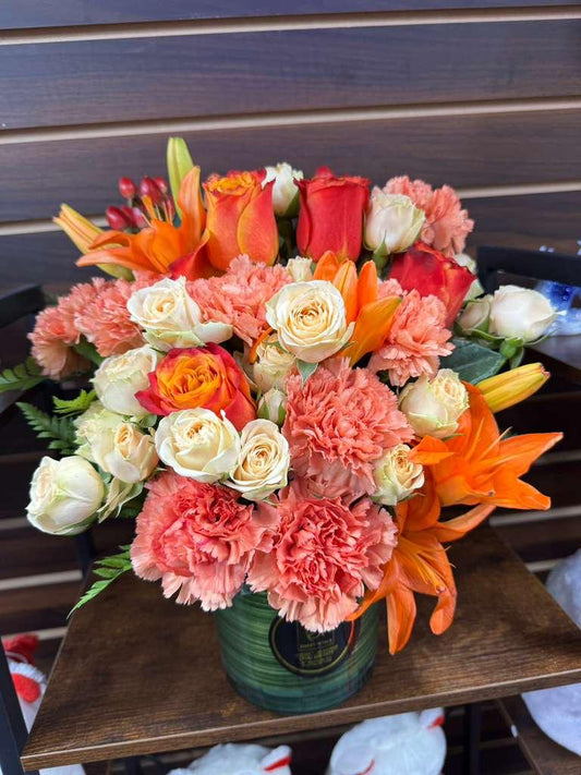 Sunset Blooms – Orange Roses, Pink Carnations & Asiatic Lilies in Teal Vase