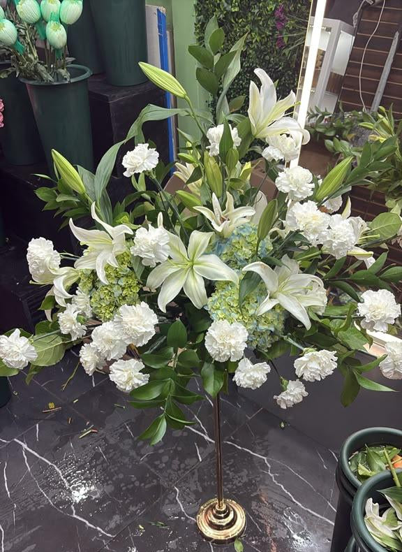 White lily and carnation centerpiece with green hydrangea on a gold stand, SweetPetals USA