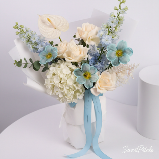 Hand-tied blue white flower bouquet with hydrangea roses cosmos in white wrap blue ribbon – SweetPetals NYC