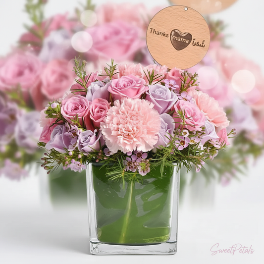 Close-up pink roses lavender roses carnations wax flowers in glass vase – SweetPetals Mother's Day flowers NYC