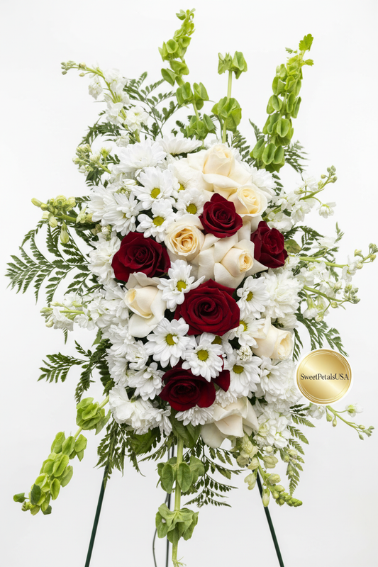 Close-up of red and white roses in sympathy standing spray — SweetPetals premium funeral flowers USA