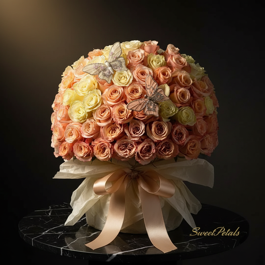 Close-up of peach champagne and cream roses with crystal butterfly pins in ivory wrap on dark marble – SweetPetals butterfly dreams luxury bouquet
