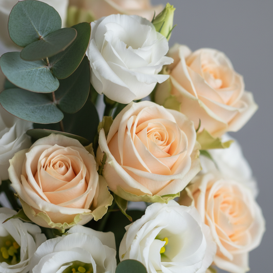 Close-up of cream peach spray roses and white lisianthus with eucalyptus – SweetPetals luxury flower delivery NYC