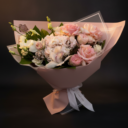 Close-up of blush pink roses white lisianthus and pale hydrangea in serene elegance bouquet – SweetPetals premium flowers