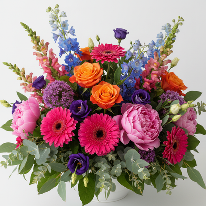 Close-up of vibrant wildflowers including pink gerberas, purple lisianthus and blue delphiniums luxury arrangement by SweetPetals NYC