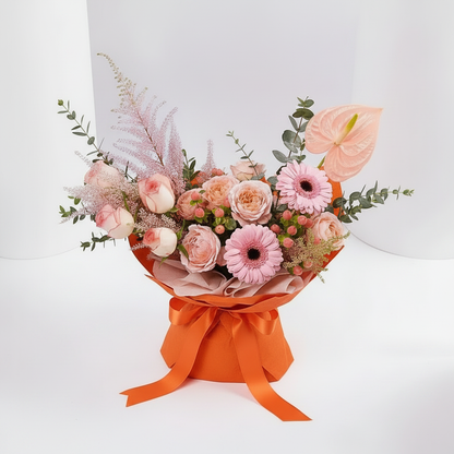 3D top angle view of pink blooms bouquet in orange wrap – SweetPetals NYC florist